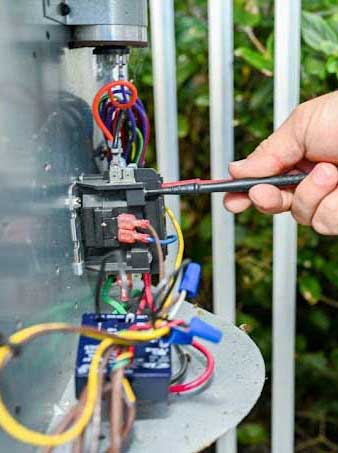 AC Condenser Electrical Testing with multimeter probes