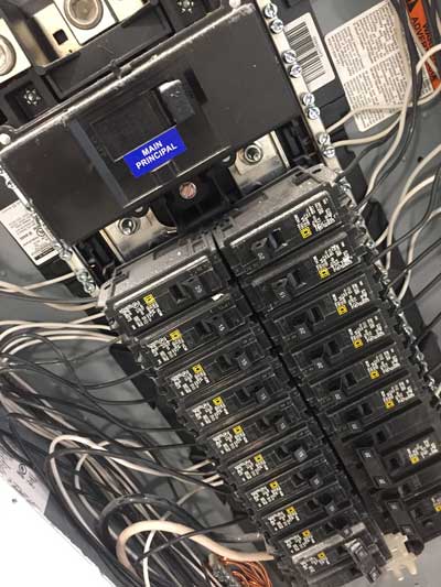 Close-up view of a breaker panel showing clean wiring after an electrical panel upgrade