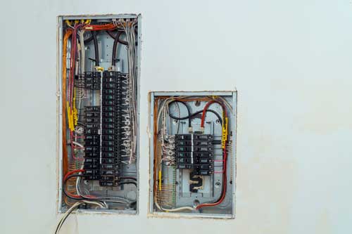 Electrical panel with subpanel installed during a home electrical service upgrade