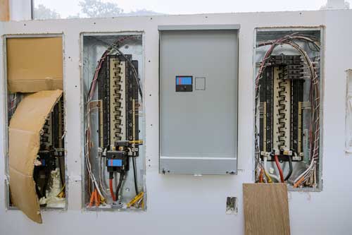 New electrical panels installed side-by-side during a home electrical panel replacement