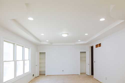 New recessed lighting installed in a remodeled living room for bright, energy-efficient illumination.